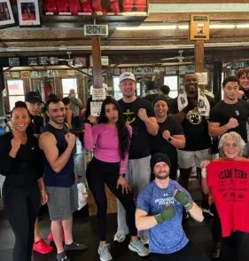 Anchor Boxing group class posing together in the gym